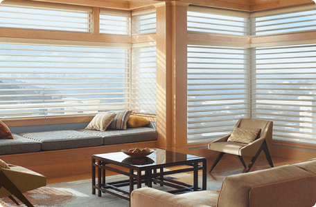 Custom blinds designed for high ceilings to enhance large windows by Bloomin' Blinds
